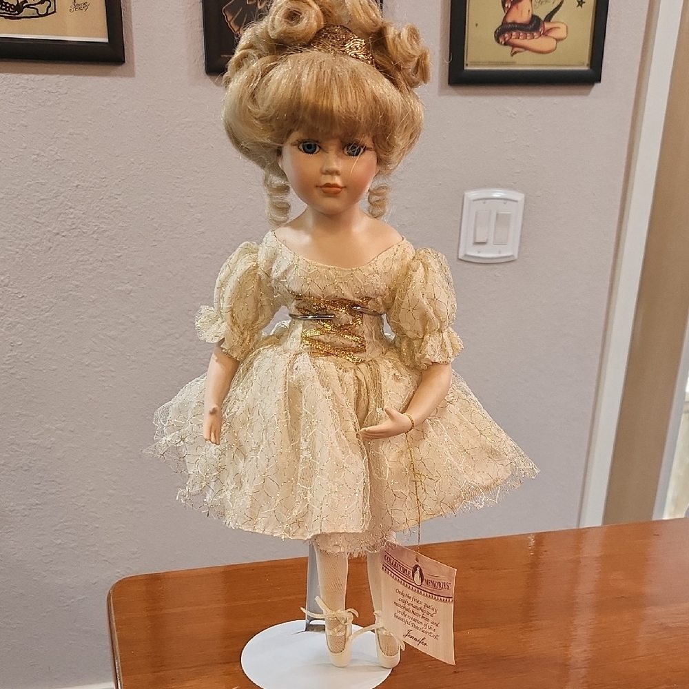 Elegant Cream Porcelain Doll with Gold Accents